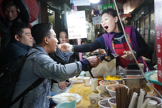 Seoul Street Food Market Tour - Eating a wide range of Korean dishes