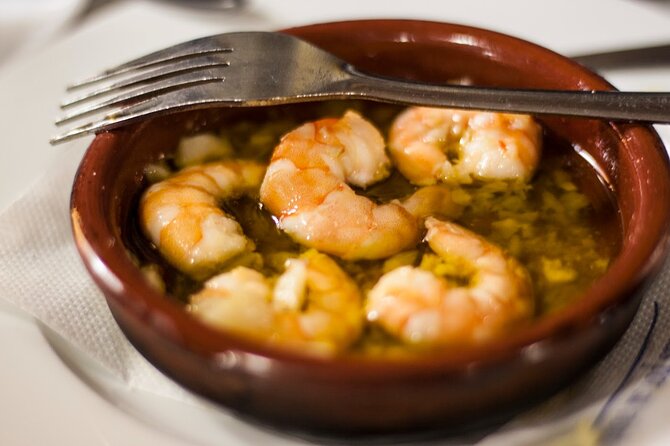 Seville Food Tour: Vermut, Churros & 10+ Tasty Local Dishes - What the guides add to the meal