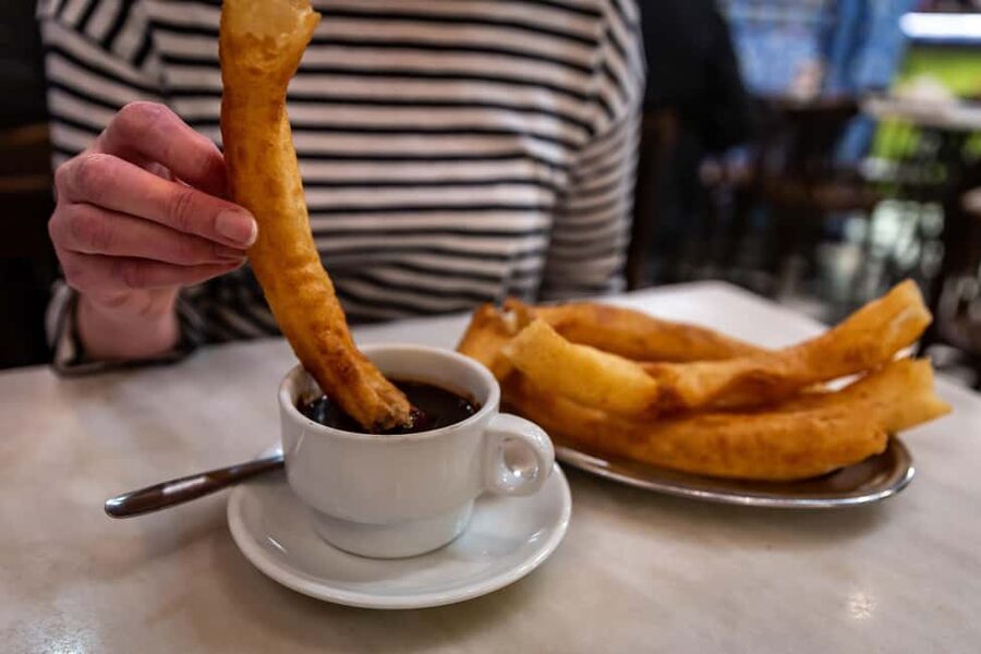 Seville: Food Tour with 10 Tastings of Tapas, Ham, Churros - Slow-cooked pork cheeks and oxtail