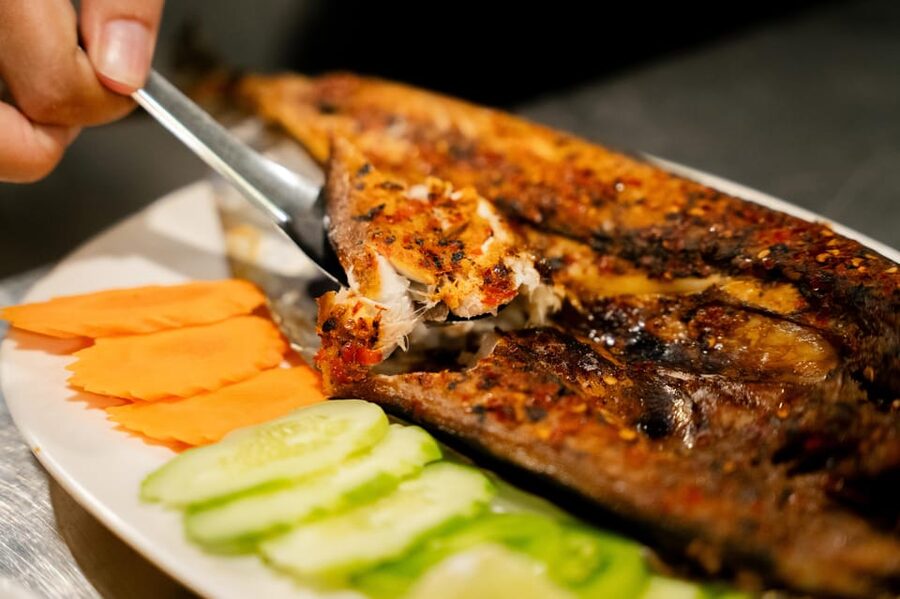 Siem Reap's Ultimate Street Food Tour by Tuk Tuk - Riverside pork ribs on the way into town
