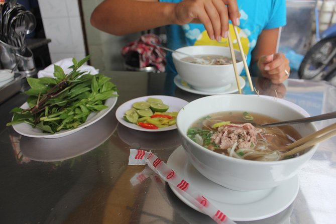 Small-group Street Food Lover by Motorbike (04 hours) - Riding through the city with a local guide