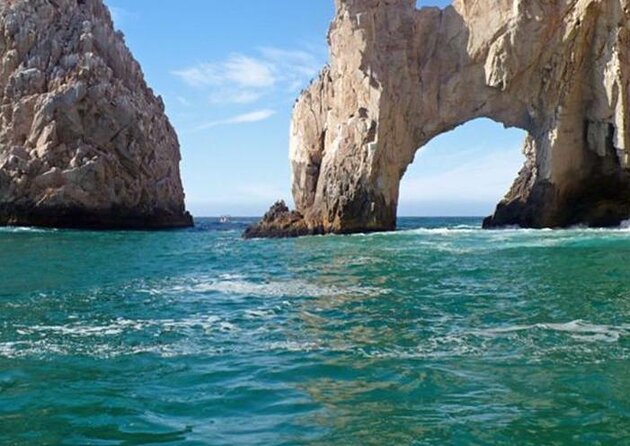 Tacos buffet & Open Bar Cruise! Los Cabos Round Transportation - A sunset view of Cabo’s famous arch