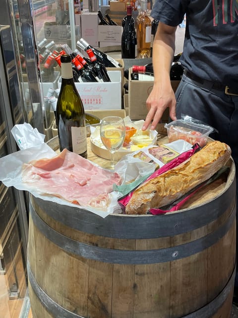 Versailles: Local & small-group Farmers' Market Food Tour - Choosing wine for the cheese platter
