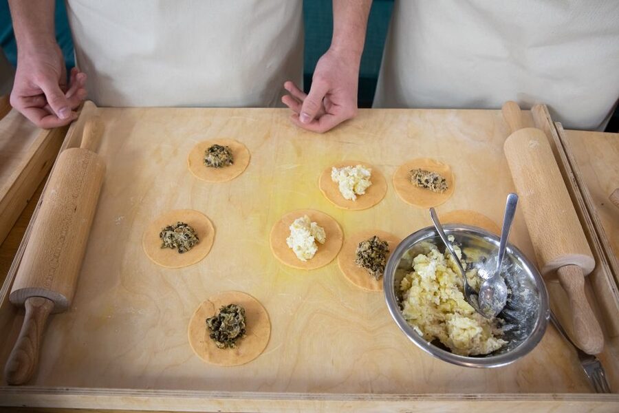 Warsaw: Polish Dumplings Cooking Class - Mixing and kneading the pierogi dough